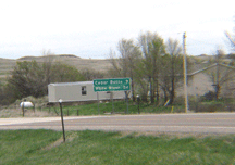 sign reads White River 24, Cedar Butte 9