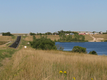 Highway 63 running along Eagle Feather Lake at Parmelee, SD.