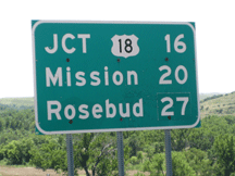 Highway sign indicating Mission and Rosebud south of Horse Creek.